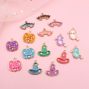 Collection of colorful Halloween enamel alloy charms including pumpkins, ghosts, and hats