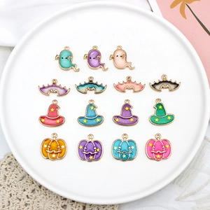 Detailed view of colorful Halloween alloy charms featuring ghosts, pumpkins, and witch hats.