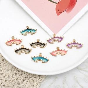 Detailed view of colorful glitter enamel bat charms for Halloween DIY jewelry crafting accessories