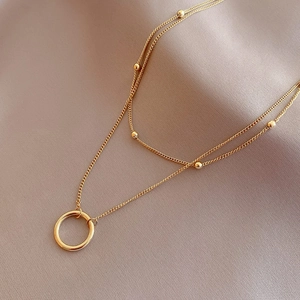 Double-layered 18K gold-plated titanium necklace with polished circle pendant and beads