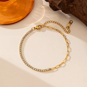 Detail of 18k gold plated titanium steel tennis and paperclip chain splice bracelet