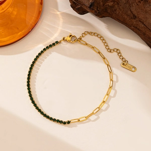 Detail of 18k gold plated stainless steel bracelet with green zircon and paperclip chain