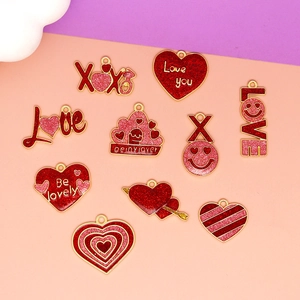 Detail view of glitter enamel Valentine's Day heart and Love theme alloy charms for DIY