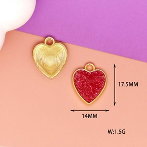 Detailed macro view of red and gold heart charms with size 17.5mm x 14mm dimensions