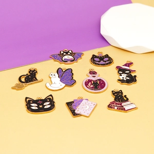 Macro view of Halloween-themed cartoon cat alloy charms in purple and black enamel