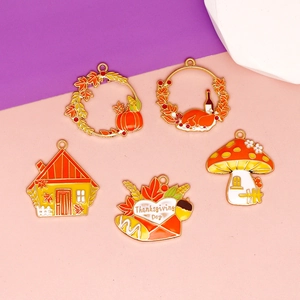 Close-up of Thanksgiving DIY alloy enamel charms featuring turkey and pumpkin designs
