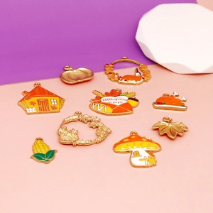 Detailed view of various Thanksgiving themed alloy enamel charms for DIY jewelry