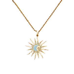 Close-up of gold sunburst pendant necklace with blue crescent moon and zircon star detail