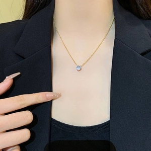 Minimalist heart-shaped light blue zircon pendant necklace with a delicate golden chain