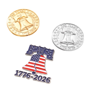 Detailed view of US 250th anniversary 1776-2026 commemorative metal coins and pins set