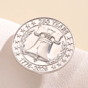 Detailed view of the 3D Liberty Bell relief on the 250th anniversary silver pin badge.