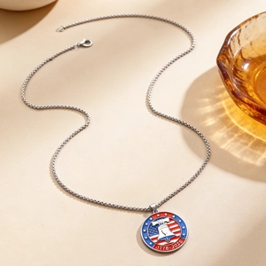 Close-up of US Liberty Bell commemorative necklace pendant with 1776-2026 inscription
