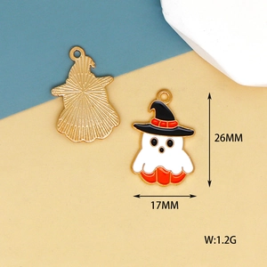 Detailed macro view of a Halloween ghost enamel charm showing 26mm x 17mm size and weight