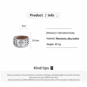 Detail of wide leather bracelet with sparkling rhinestones and cross motif design