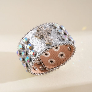Detailed view of silver sequined cuff bracelet with crystal cross and AB stones
