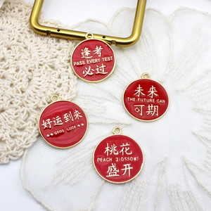 Detail of red enamel alloy charms with Chinese blessing characters for DIY jewelry