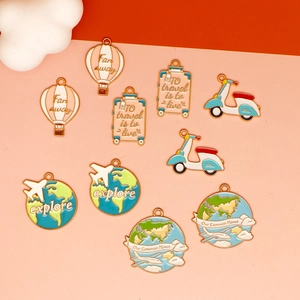 Detailed collection of colorful travel-themed enamel charms including balloons and globes