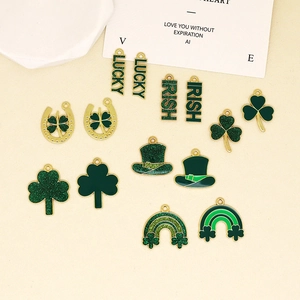 Detailed view of St. Patrick's Day green enamel clover and lucky letter DIY charms