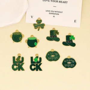 Detail view of assorted green enamel St. Patrick's Day charms with clover motifs
