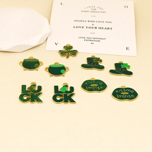 Detailed view of St. Patrick's Day DIY enamel charms set featuring green clover and luck hat