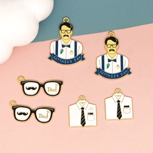 Macro view of Father's Day alloy charms featuring detailed shirts and glasses designs
