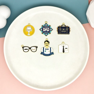 Variety of Father's Day enamel charms including Dad motifs, shirt, and trophy designs.
