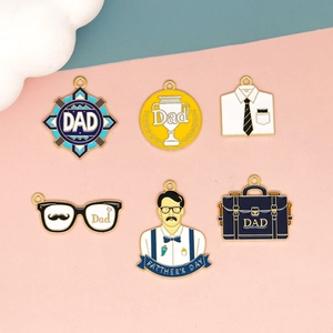 Set of diverse enamel Father's Day charms including Dad trophies and glasses motifs