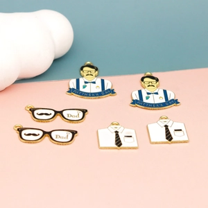 Detailed close-up of Father's Day alloy charms featuring mustache man and Dad designs