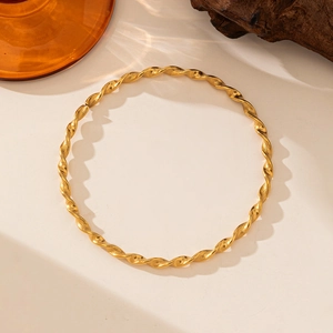 Polished 18K gold plated knotted twist bangle with minimalist geometric design for women