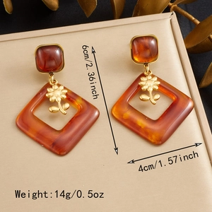 Detail view of vintage amber resin earrings showing 6cm length and 4cm width dimensions