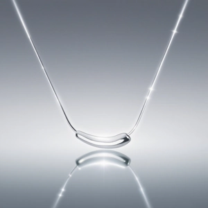 Polished silver curved bean necklace with minimalist sleek chain and mirror finish