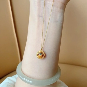 Ethnic style gold necklace with colorful enamel pendant and polished delicate chain
