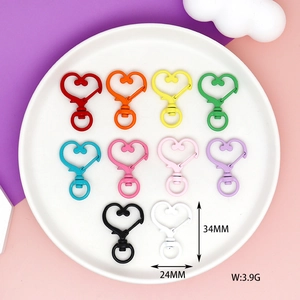 Macro detail view of colorful heart-shaped lobster clasps for DIY jewelry and crafts