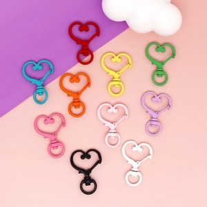 Collection of colorful heart-shaped lobster clasps for DIY jewelry making and crafts.