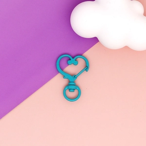 Detailed view of a turquoise heart-shaped lobster clasp for DIY jewelry and accessories