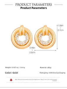 Detailed view of gold geometric earrings featuring dimensions and inlaid crystals