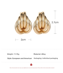 Detail view of gold knotted alloy hoop earrings showing dimensions 2.7x2cm and specs