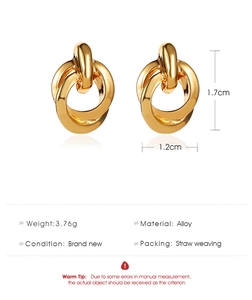 Detail view of golden knot earrings showing 1.7cm height and 1.2cm width dimensions