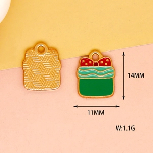 Close-up of green gift box Christmas charm with 14mm height and 11mm width measurements