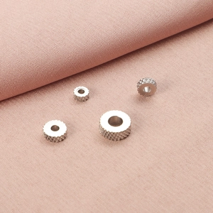 Detailed close-up showing the knurled texture of stainless steel gear spacer beads