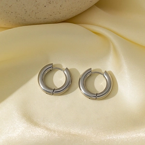Minimalist silver hoop earrings in polished stainless steel with a chunky design