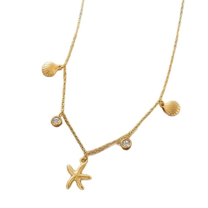 Gold plated stainless steel necklace featuring starfish, seashell charms and cubic zirconia