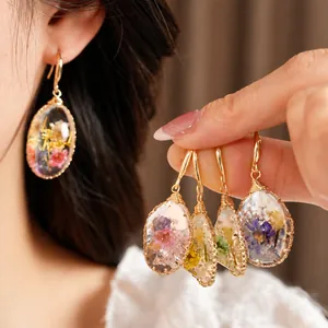 Handmade resin dried flower drop earrings in pastoral style for elegant women's jewelry.