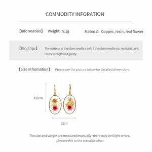 Detailed view of oval resin earrings with real flowers showing 4.8cm height measurement