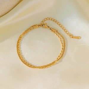Double-layer gold titanium steel bracelet with oval beads and twisted rope chain design