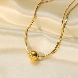 Double-layered gold stainless steel necklace featuring snake chain and bead pendant