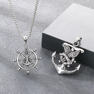 Detailed view of retro punk nautical helm and eagle anchor titanium steel pendants