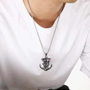 Macro view of a retro titanium steel anchor pendant with an eagle motif.