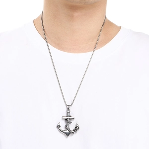 Detail view of a men's titanium steel nautical anchor pendant with a skull and rope detail.