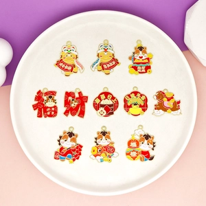Detailed view of eleven different Year of the Horse zodiac alloy enamel charms on a plate.